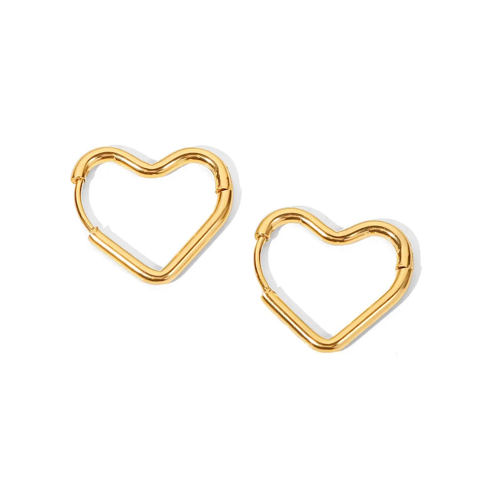 "✨ Stylish Gold Heart Earrings for a Chic Look! 💖 #Fashion #Jewelry"